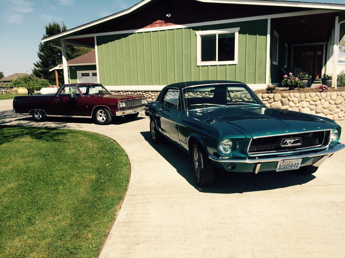 My first car, a 1967 mustang, and my Grandpa's 1964 El Camino.