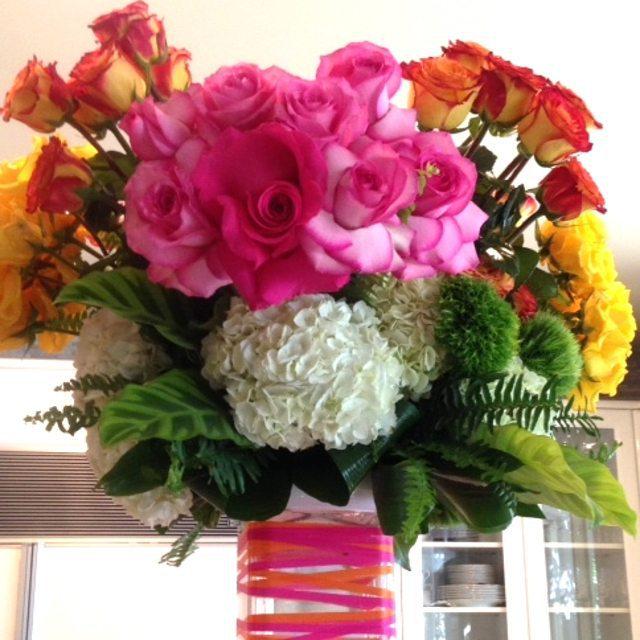 sacksprods's tweet photo. A bright arrangement by @petalsla - the colors were perfect for our 80's party theme. http://t.co/nmEv4GqyVD