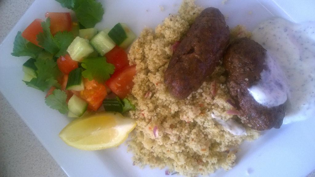 kellycapewell's tweet photo. For dinner.Lamb kofta with cous cous and cucumber and tomato salad http://t.co/np1y4UYKGJ