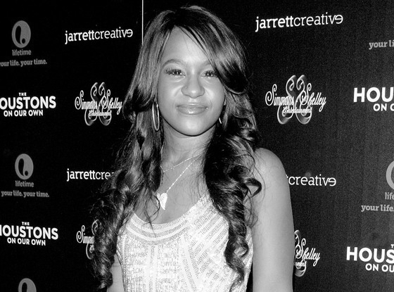 enews's tweet photo. Bobbi Kristina Brown has officially been laid to rest next to her mother Whitney Houston: http://t.co/1NdIEWRMuz http://t.co/2INlSyv1Fu