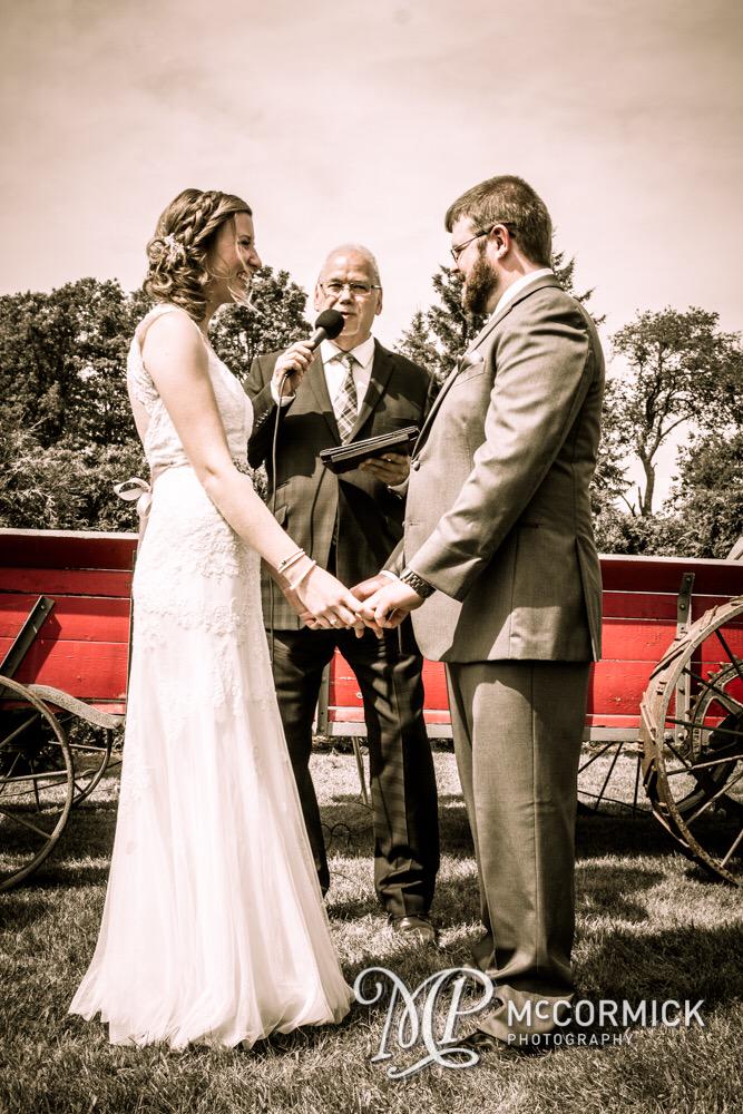Mr & Mrs saying their 'I do's' at @StromsFarm this past #wedding with awesome #officiant, Martti from @kcwedding