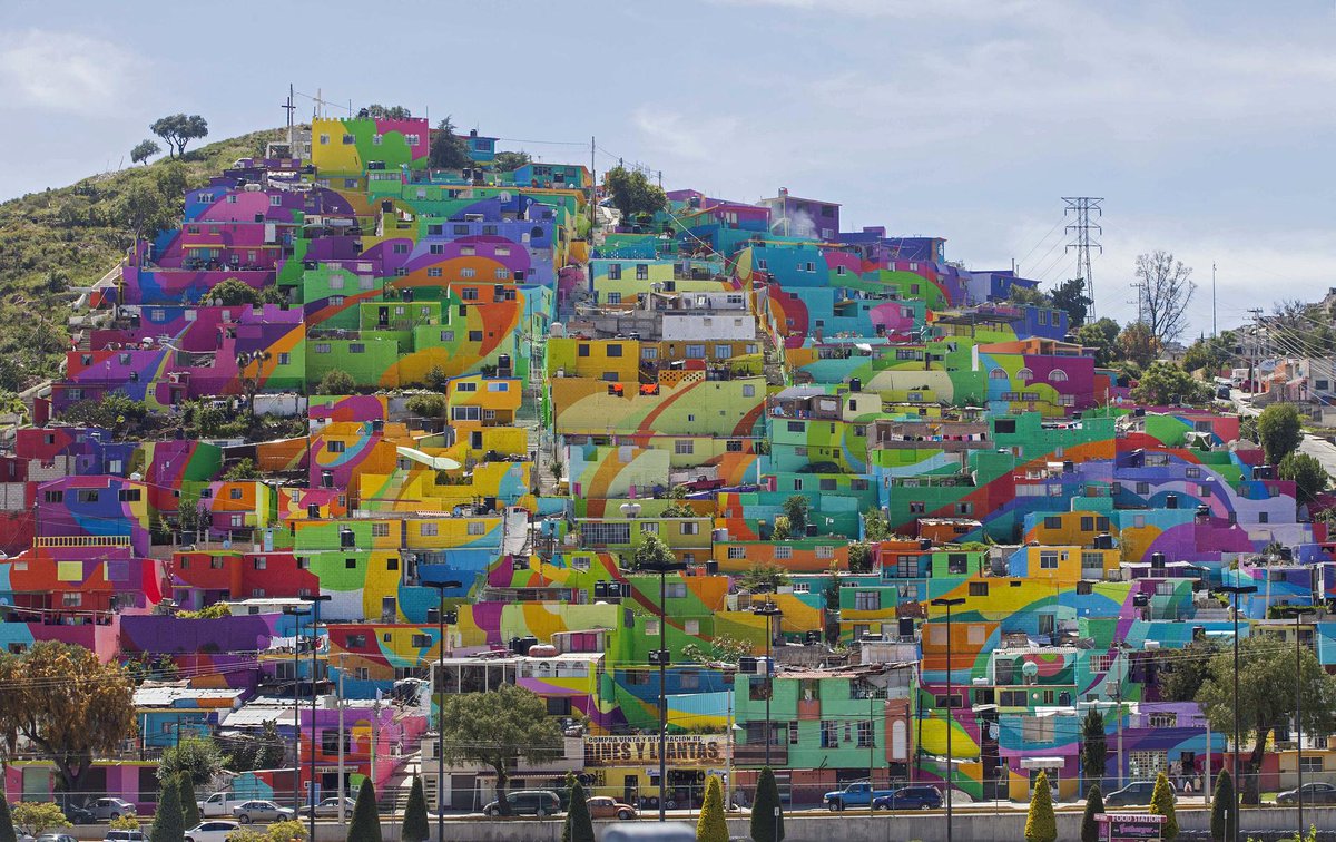 guardian's tweet photo. Mexico's largest mural brightens up town – in pictures http://t.co/6SHNRyWGN8 http://t.co/fSCSb1NGv3