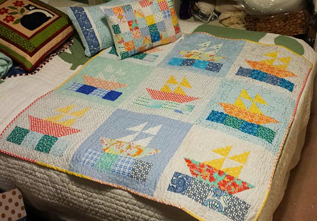 TidelineQuilts's tweet photo. My Scrappy Sailboats quilt is finished...and looking for an adorable baby to cuddle up with! http://t.co/RbZ3vkZhgO