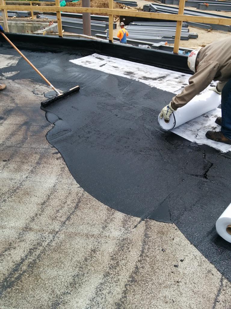 SanoAssociates's tweet photo. DeBruce Center, Lawrence, KS. Western Waterproofing banging out 6k SF of #mm6125 in 5 hours. @Hydrotech6125 #pmr http://t.co/mlwzVXRezN
