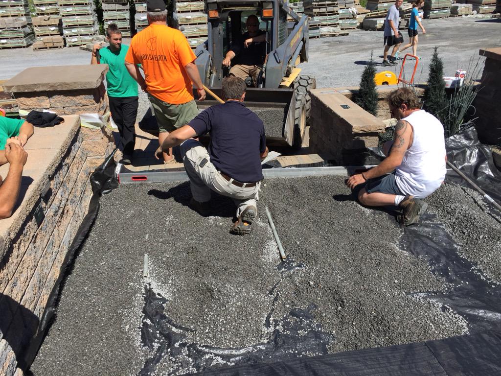 @AndrewKufen prepping the bedding layer at @DragunLandscape today. #PermeablePavement training, contractors helping