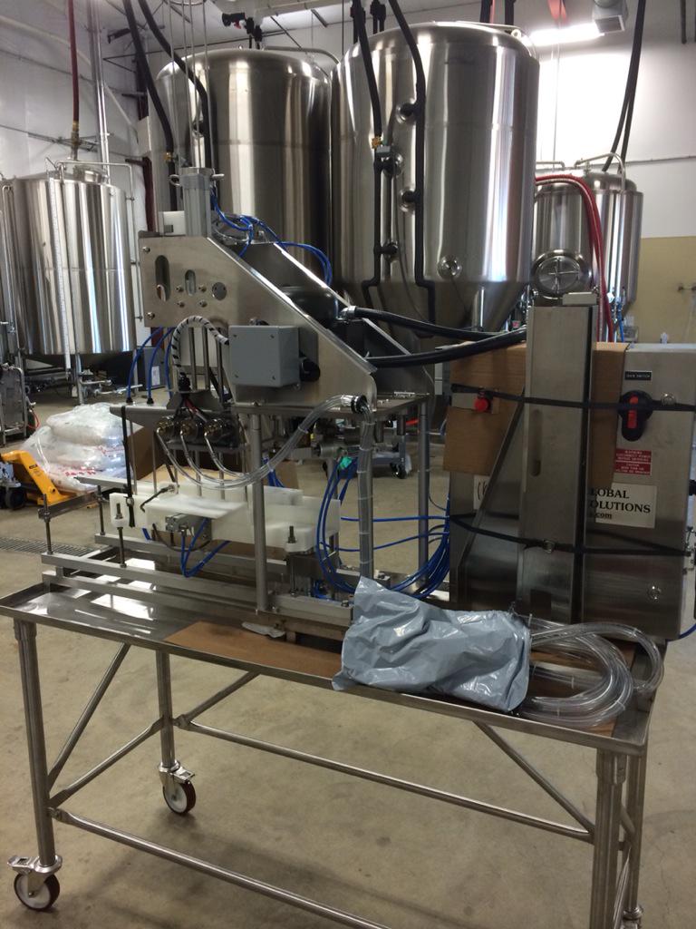 StickyHands_IPA's tweet photo. Cask canning line. I'm going to work you hard this fall! Just need the damn cans to show up. #stickycans #block15 http://t.co/rFAZJZhXT7