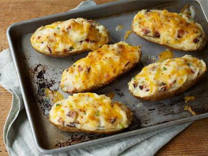 FoodNetwork's tweet photo. Give in to @ThePioneerWoman's Cheesy Twice-Baked Potatoes: http://t.co/6dIAI54wox. http://t.co/ApJbCEKiEJ