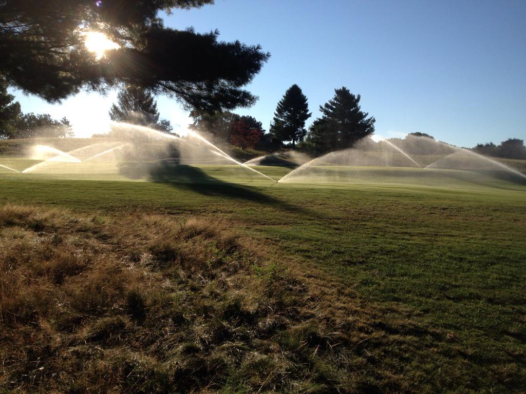 Applying #wettingagent to fairways. Using extra water this morning, to save water in long run.