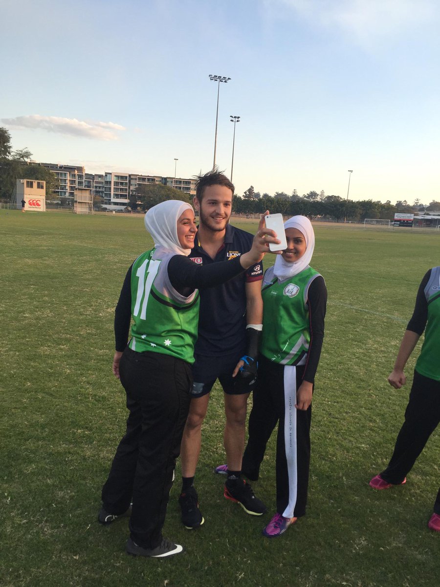 AFLQ's tweet photo. Australia Post AFL multicultural Ambassador @JamesAish getting swamped for selfies at AFLQ's #WorldFiesta http://t.co/NvUEKgBaX1