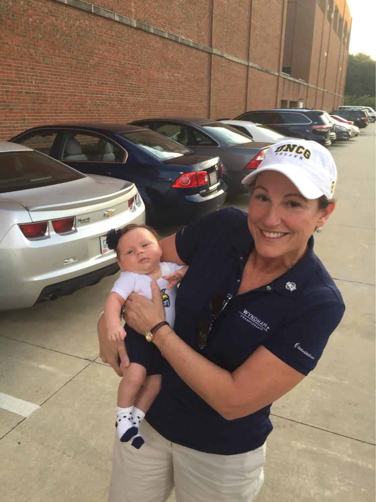 Evan meets the UNCG Director of athletics Kim Record at her first UNCG woman's soccer game.
