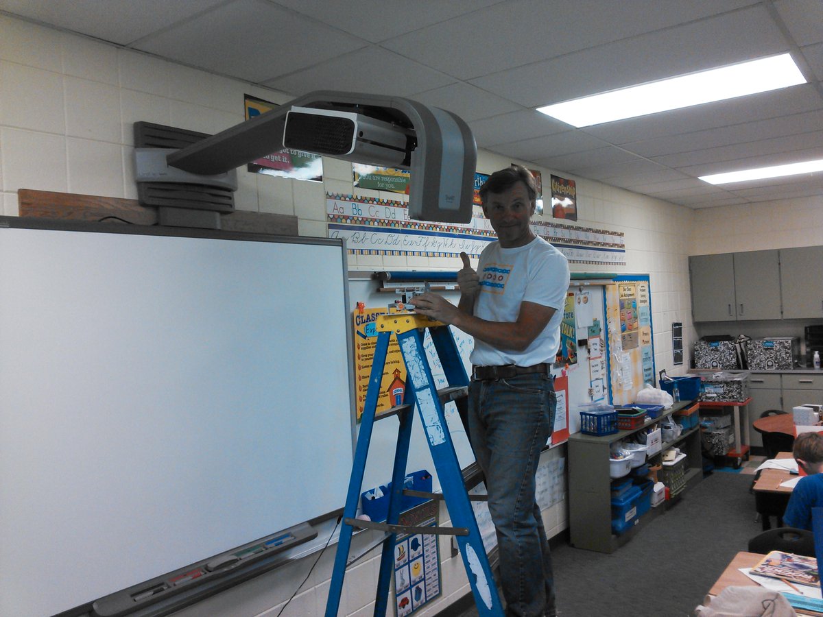 NorthBooneTech's tweet image. Ex Team Poland Cyclist Kris Wiatr replacing Smartboard Projectors through out the district today!