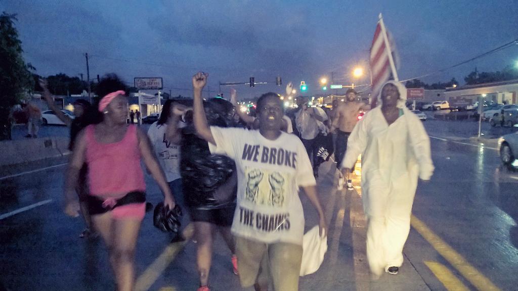 ChuckModi1's tweet photo. Streets of #Ferguson now. Pouring rain. Lightning. No CNN. No one cares. #WorldWatchesFerguson http://t.co/vYO6aoLZXN