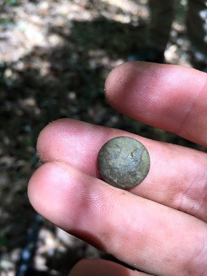 TFHistory's tweet image. Eagle button found at Andersonville by Heath Jones while helping the NPS. This button likely belonged to a prisoner.