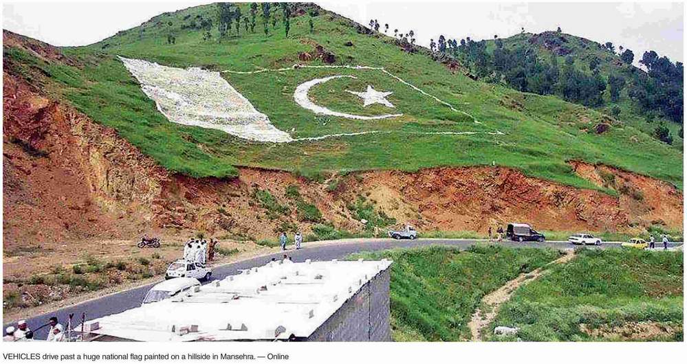pukhtanajinai's tweet photo. #گران_وطن_پاکستان
 A huge national flag painted on hill side in mansehra http://t.co/NzKlgSGne0