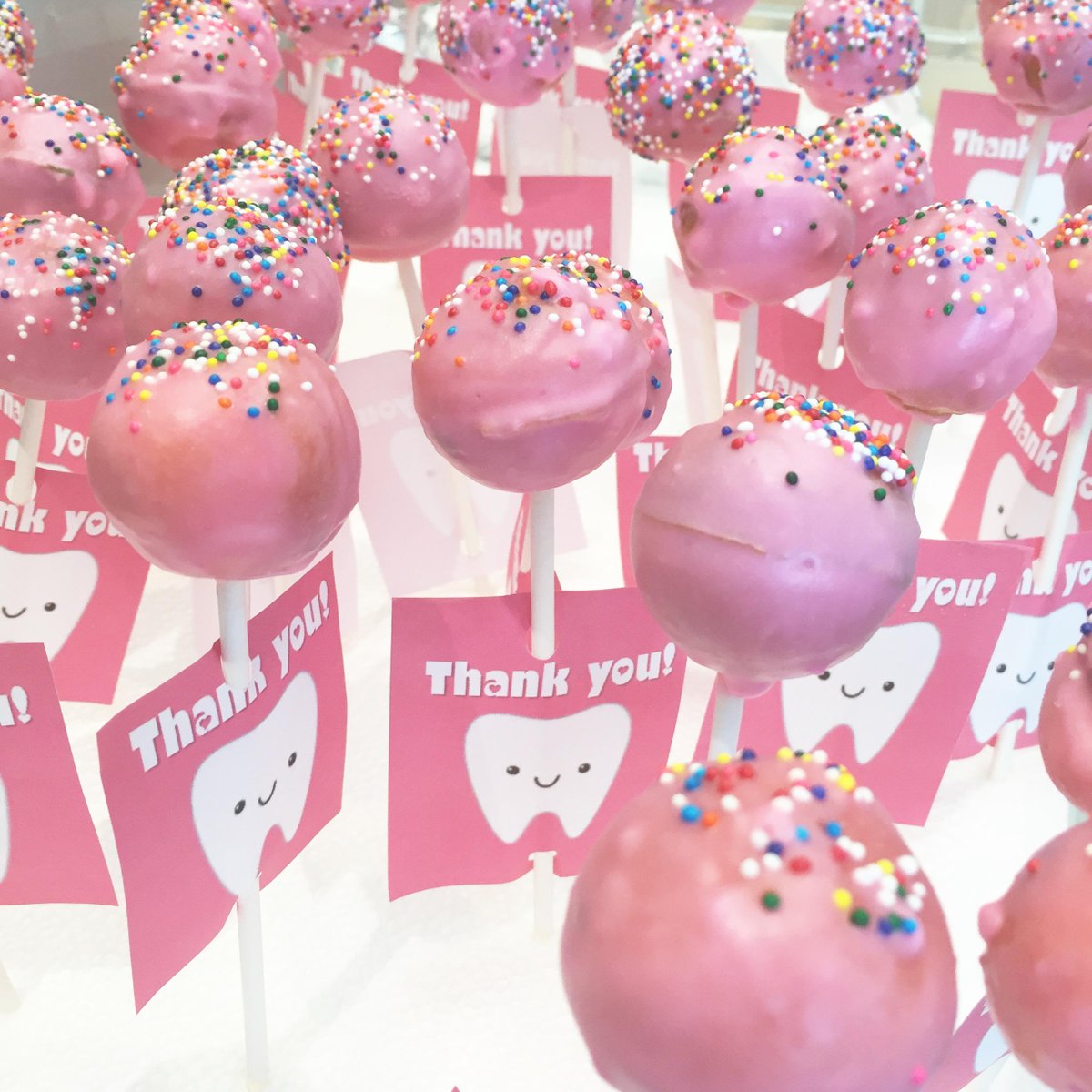 ILikeMyTeeth's tweet photo. Saying farewell to our awesome summer intern, Ashley. These cute cake pops remind us that #LifeIsBetterWithTeeth. http://t.co/0T1T88dF9S