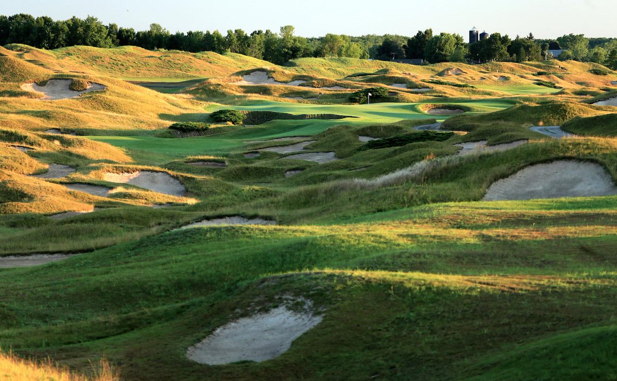 Total bunkers:

Augusta: 43
St Andrews: 112
Chambers Bay: 65
Whistling Straits: 976

Yup, that's 53.7 per hole!