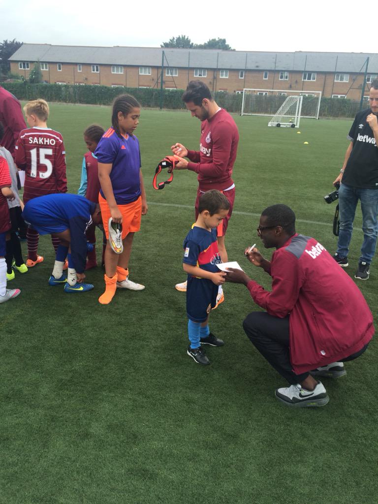WHUFoundation's tweet photo. PIC: @MrMattJarvis and @Obiang14 sign autographs at our Beckton Soccer Schools #WHUFC #COYI http://t.co/J3FDwUQZfF