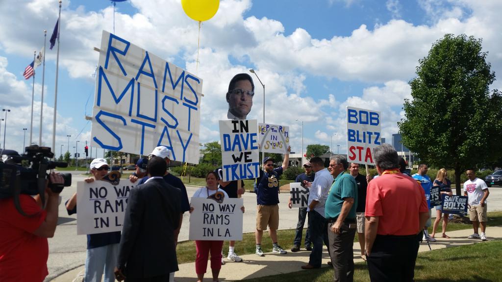 KaplanSportsBiz's tweet image. St Louis rams and SD chargers fans outside the NFL owners meeting hotel today. no raiders fans, so not so loud