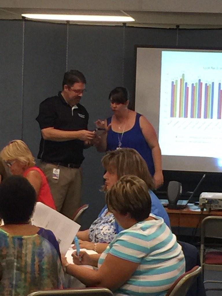 terry_robbitl's tweet photo. Principal Campbell and Ilea Faircloth leading the Cast members of the Grove in an awesome inservice! http://t.co/UmgplAwmOp