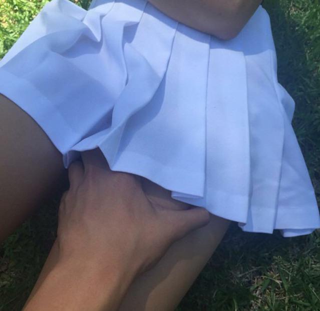 harry bringing his hand up louis' skirt. "mine"