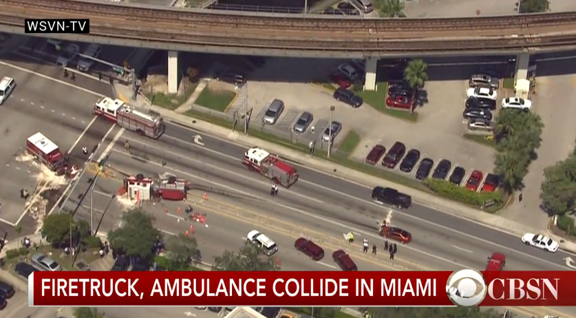 CBSNews's tweet photo. DEVELOPING: Fire truck and ambulance collide in Miami, Florida; at least 12 people injured http://t.co/TCG12QM7Xt http://t.co/7rHQ8N2afo