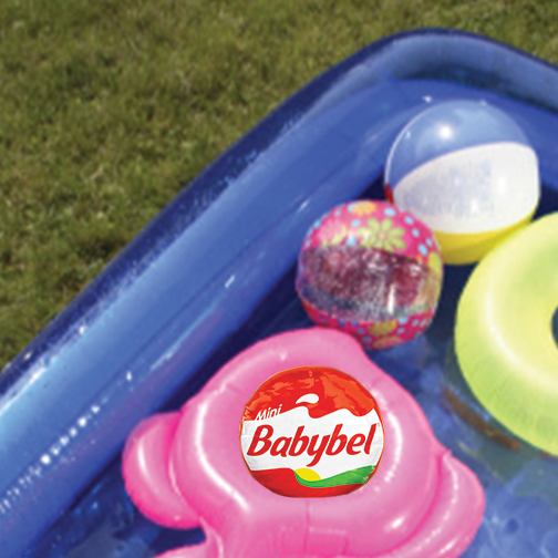 Babybel's tweet image. Time to chillax with some cheese wrapped in wax. (Just a little poolside rhyme I’m working on…) #PoolCool