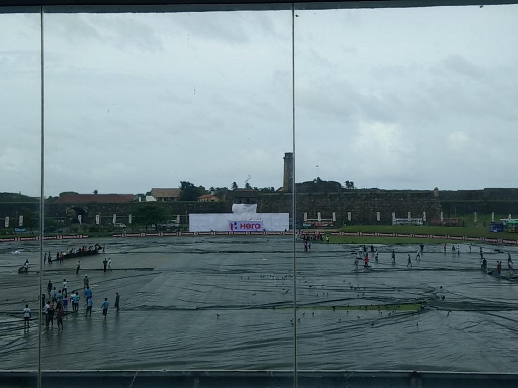 Ajith_tweets's tweet photo. Say Goodbye to the covers. Clouds moving away. Let the #CricbuzzCup begin #IndvSL Pic: view from sponsor box in Galle http://t.co/jsUgFrHIYH
