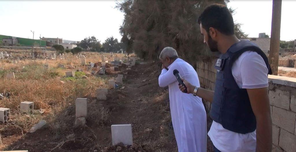 This grandfather cries at the graves of his five grandchildren killed by United-States led international coalition air strikes on Atmeh, Syria