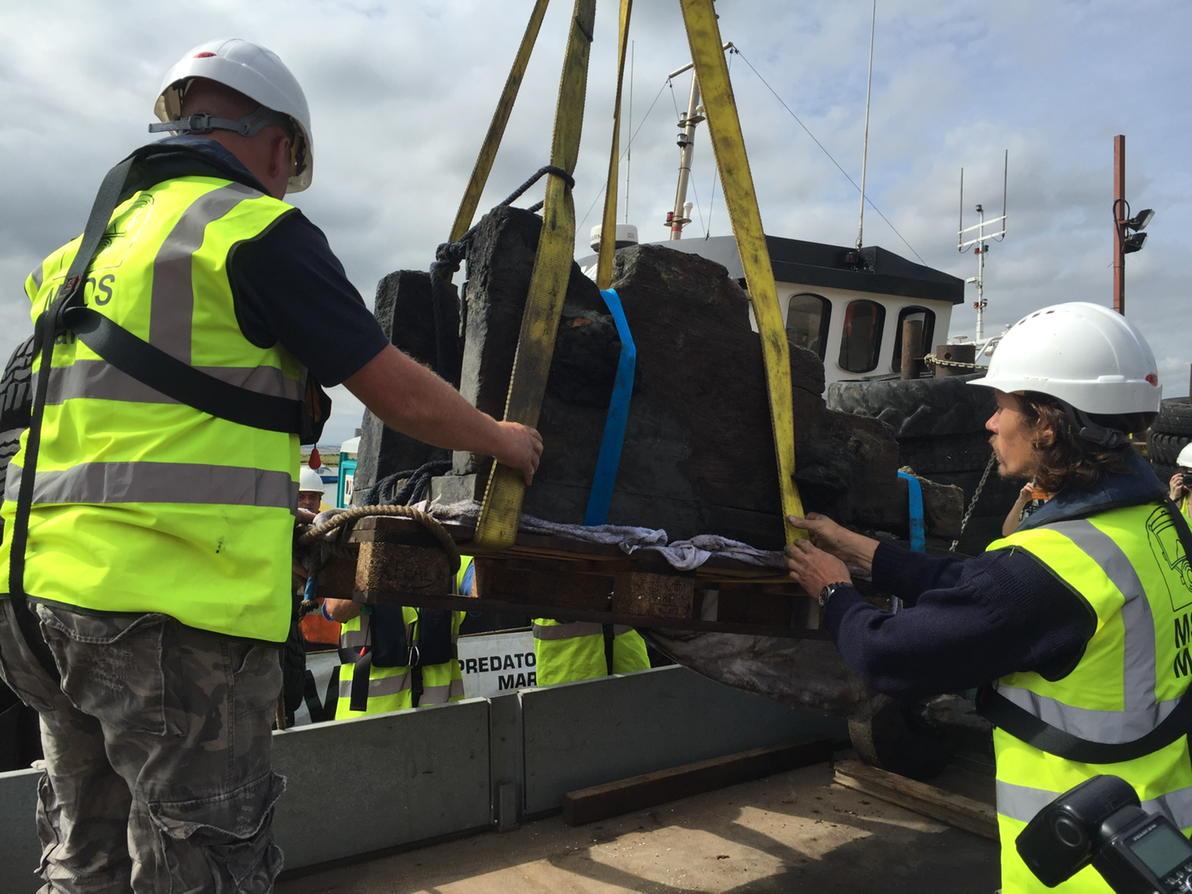 A gun carriage from the wreck of HMS London which blew up in the Thames in 1665 being landed at Leigh this morning.