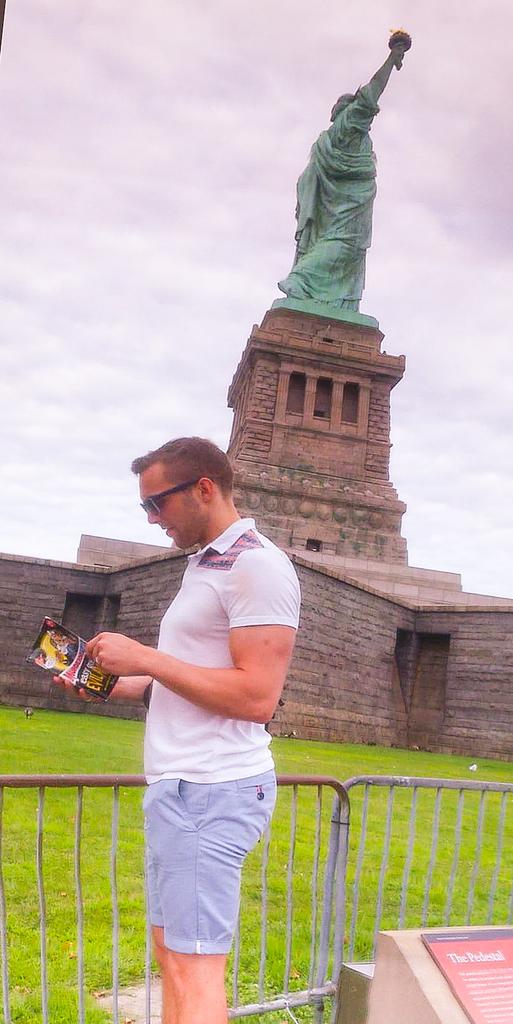 NeatherdMaths's tweet photo. @NeatherdLibrary #travellingtales Mr Everett reading @ the statue of liberty! He's got more to share too! @Neatherd http://t.co/5W7waBX9F3