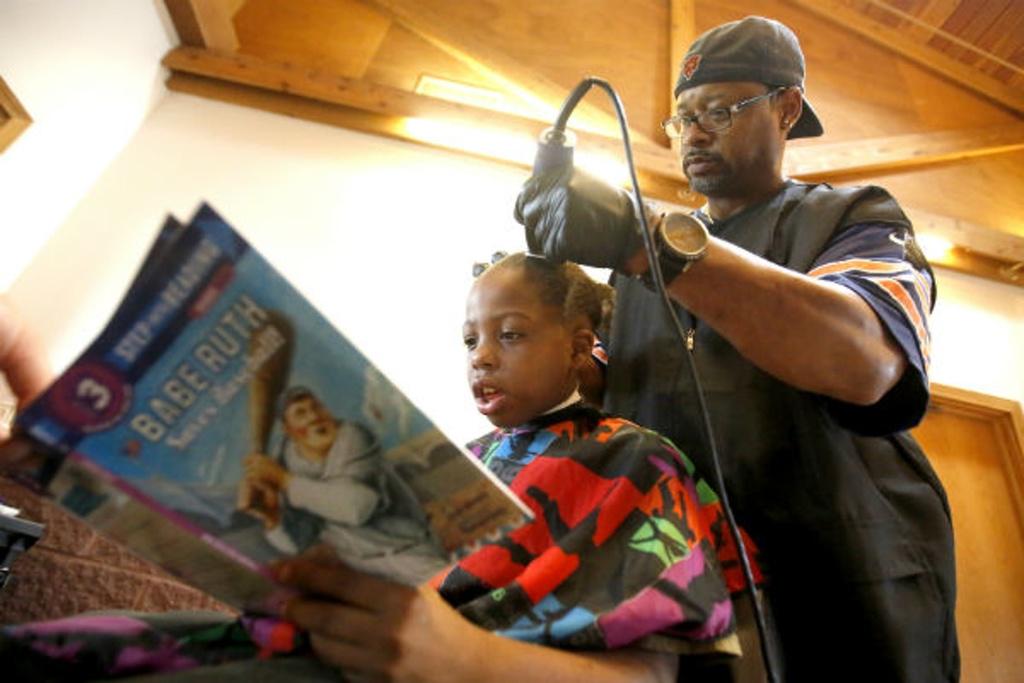 Upworthy's tweet image. A barber in Iowa gave kids free back-to-school haircuts, but only if they read him a book. u.pw/1gEoY4p