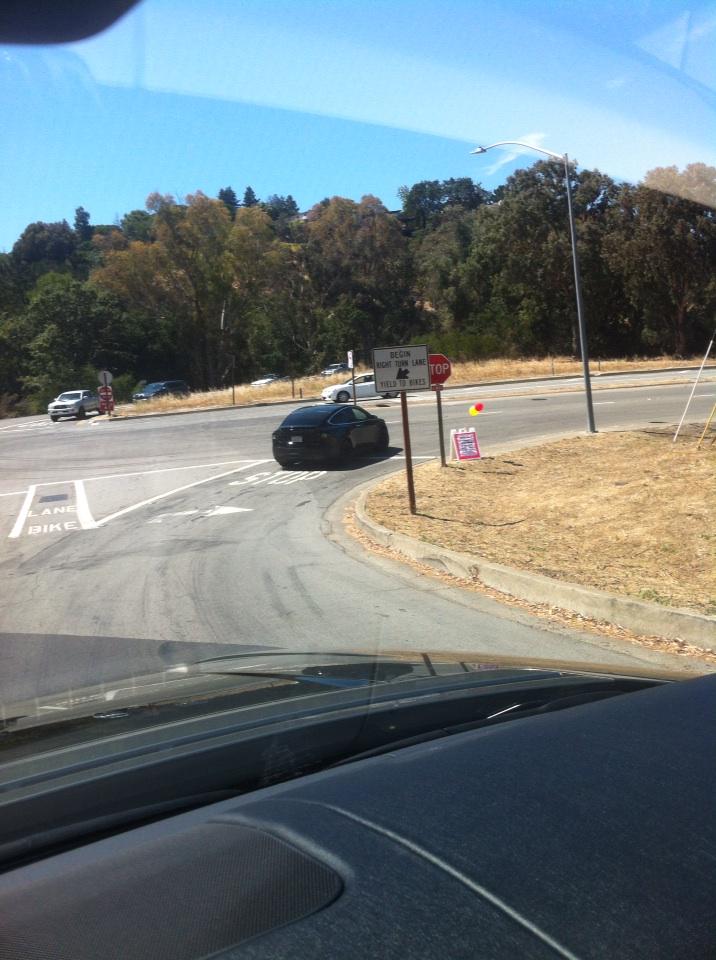 Followed a prototype of the new tesla SUV home from work yesterday. Rocket fast.