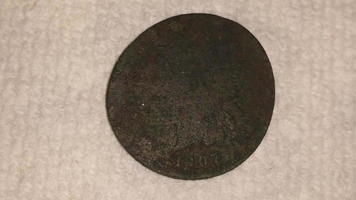 TFHistory's tweet image. 1907 Indian Head penny that was placed on a railroad track at some point.