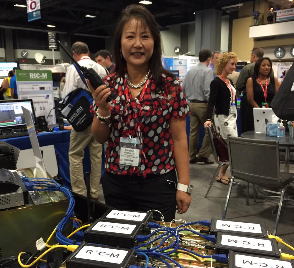 dhsscitech's tweet image. S&T’s Christine Lee demoing Radio #InternetProtocol #Comms Module (go.usa.gov/tafH) in booth 1915 #APCO2015