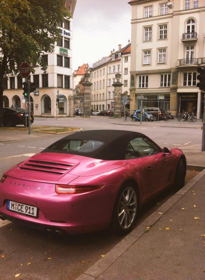 IannisMatthieu's tweet photo. A pink #porsche in front of an ancient door 
#modernity is everywhere in #Munich 
#globalization #ModernFamily http://t.co/EZfn6ZnOJy