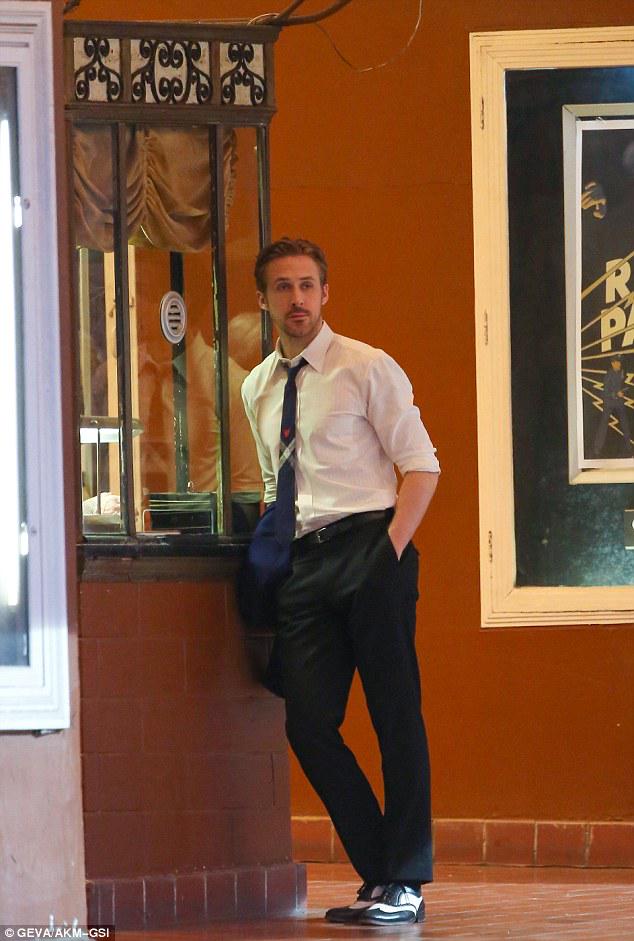 ryan gosling dress shirt Ryan Gosling wearing White Long Sleeve Shirt, Grey Wool Dress Pants, Black Leather Belt, Black Sunglasses