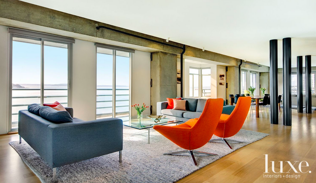 luxemagazine's tweet photo. This spacious seating area is punctuated by contemporary orange chairs: http://t.co/M2lI6or89F http://t.co/mQdcsKjDB4