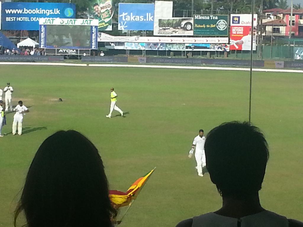 RusselArnold69's tweet photo. The End of a golden era. ...The final walk back... well done @KumarSanga2 It's gone very quite here in Colombo http://t.co/eSlEmqKzNe