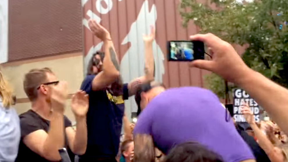 esquire's tweet photo. The Foo Fighters "Rickrolled" the Westboro Baptist Church. This is glorious: http://t.co/C2nQLUl2t5 http://t.co/KqEmq9VUWK