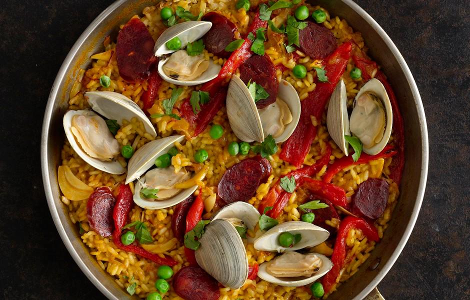 bonappetit's tweet photo. Paella is actually something you can and should make on a weeknight http://t.co/8v3L2zH0c7 http://t.co/2TOpnRvrBO
