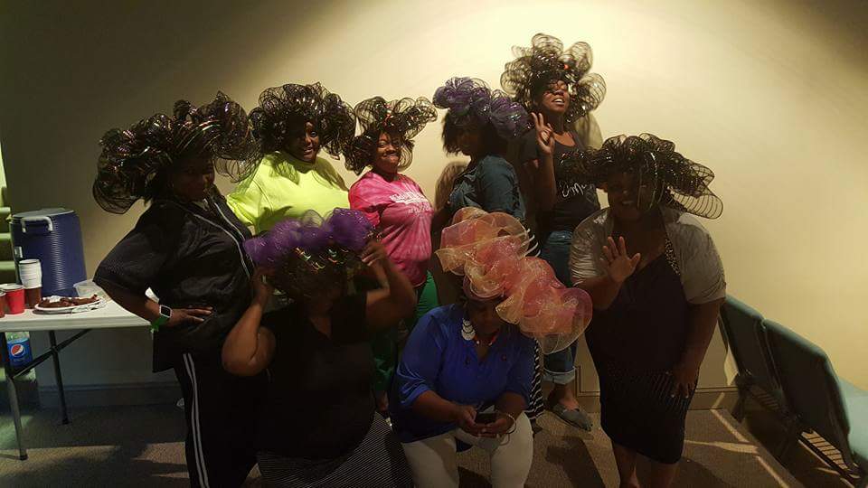 UnityWorship1's tweet photo. What a turn out! The women made wreaths today at #VirtuousWomen. A few chose to wear them as HATS here #Fellowship http://t.co/q4pCthlVma