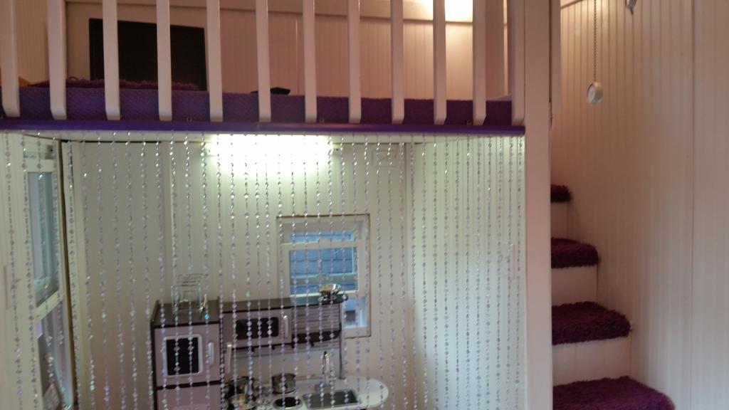 Working front porch area and kitchen of daughter's playhouse. Still need to do counters in kitchen, maybe cabinets ☺