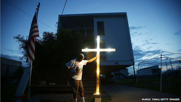 "Our boat was stuck on the apex of a rooftop" - photographer <a href="/mario_tama/">Mario Tama</a> on Hurricane Katrina bbc.in/1Vd8fVa