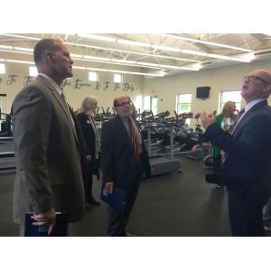 Dr. Tony Smith admiring JJH rock wall and wellness center