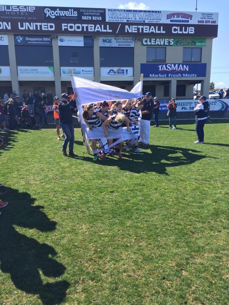 Mooroopna Cats Youth Girls bursting through the banner before there Grand  Final today at Deakin Reserve