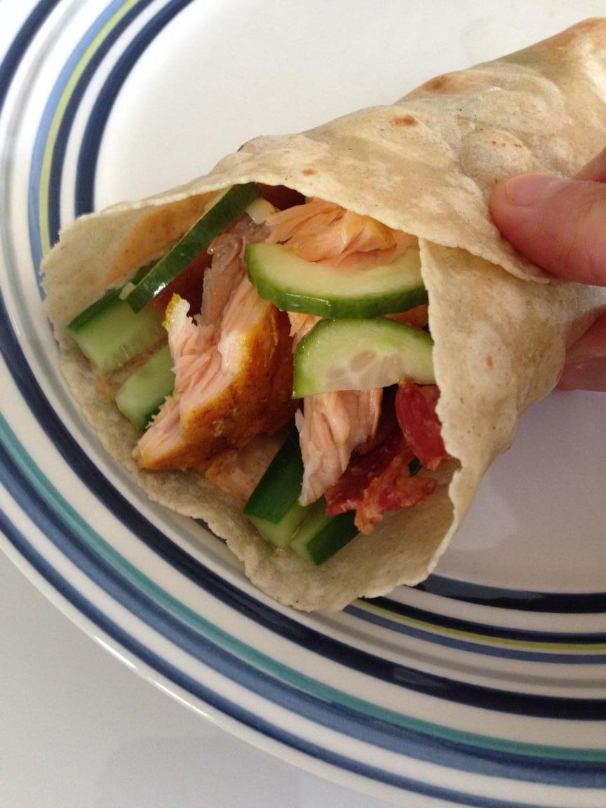 LeftoverLunch wrap.Baked salmon,Asian cucumber salad,bacon, @Organicville siracha,mayo on @rid isglutenfree tortilla