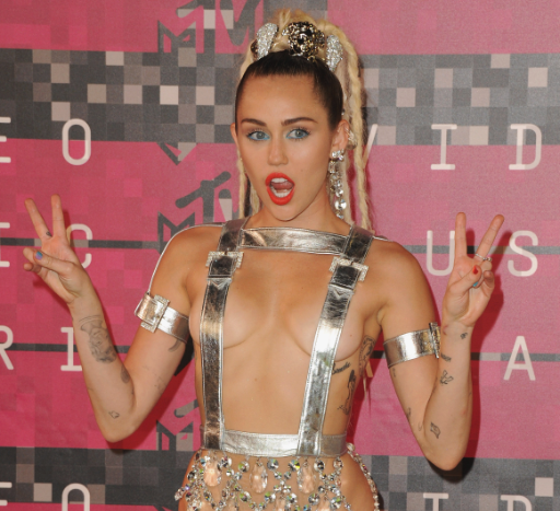 Sugarscape on X: Miley Cyrus had an unexpected nip slip during the #VMAs:  'Oh sorry, my tit's out'   / X