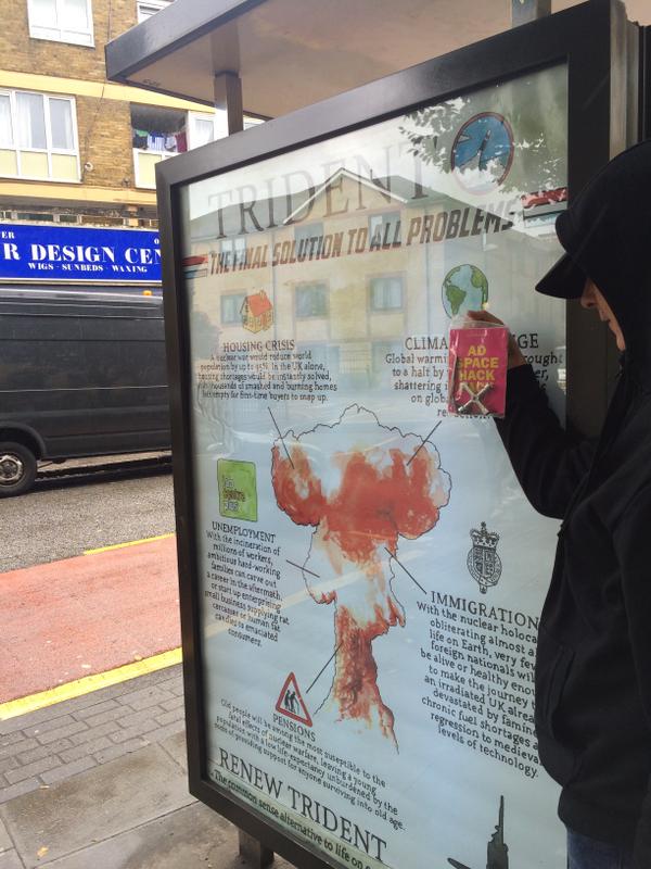 GavinGrindon's tweet photo. Artists in Banksy's #Dismaland visit London for opening day of DSEI arms fair. Put up ads across city. #StopDSEI http://t.co/oplIF7m6zH