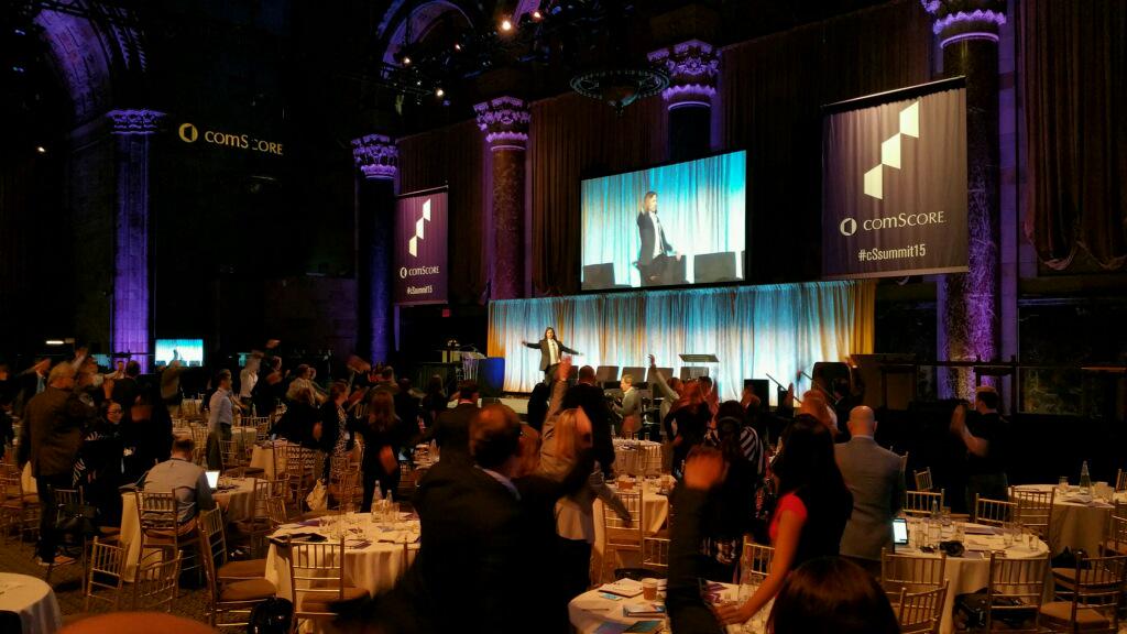 Comscore's tweet image. Coach Dan getting the crowd moving at #cSsummit15!