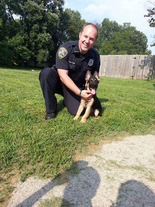 southbendpolice's tweet photo. Off. Rohrscheib rescues this lil-fella who locked himself in a running car. Puppy/owners/car are 10-4!! #lockouttools http://t.co/cW6fbFNzDg